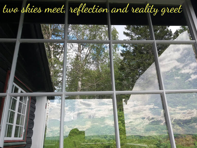 Photo of forest through window, with two reflections of sky and the photographer. Text: two skies meet, reflection and reality greet