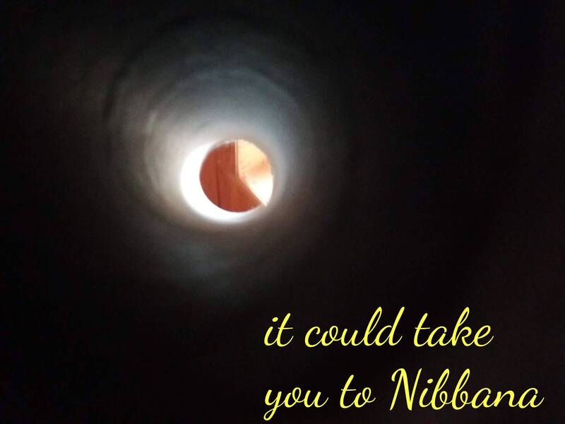 artistic photo of narrow tunnel of toilet paper roll and window frame on the other side, and the text "it could take you to Nibbana"